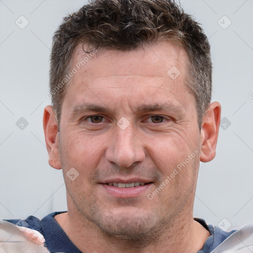 Joyful white adult male with short  brown hair and grey eyes