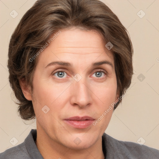 Joyful white adult female with short  brown hair and grey eyes