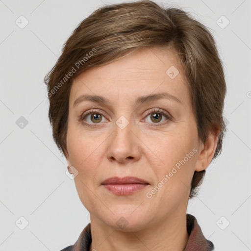 Joyful white adult female with short  brown hair and grey eyes