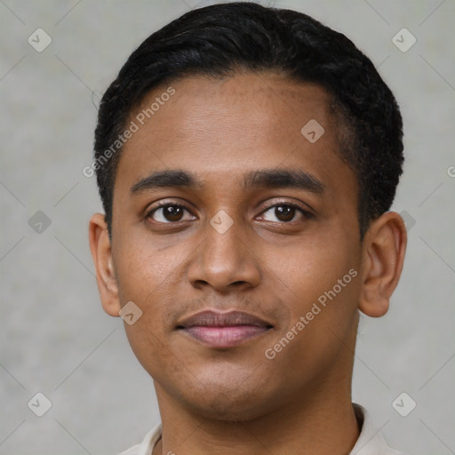 Joyful black young-adult male with short  black hair and brown eyes