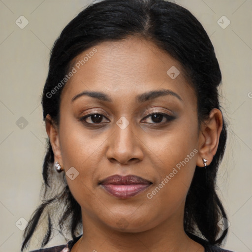 Joyful latino young-adult female with medium  brown hair and brown eyes