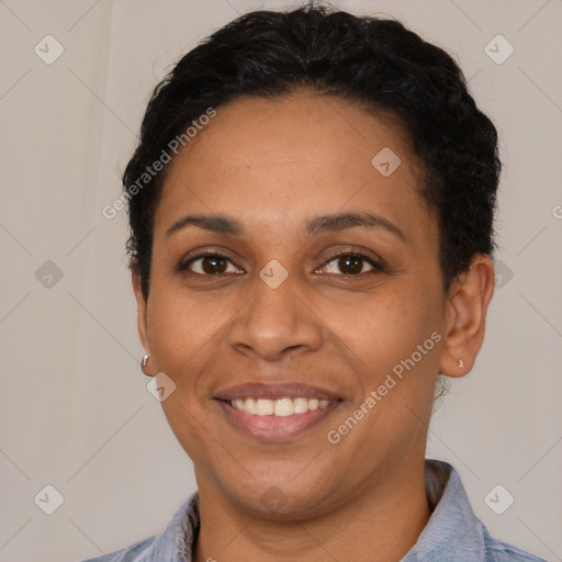 Joyful latino young-adult female with short  black hair and brown eyes