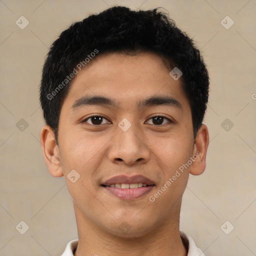 Joyful latino young-adult male with short  brown hair and brown eyes