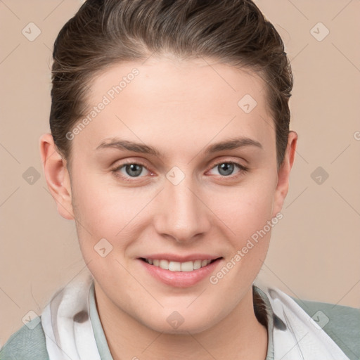 Joyful white young-adult female with short  brown hair and grey eyes