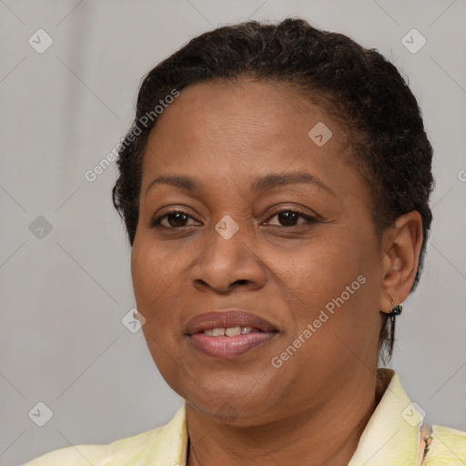 Joyful latino adult female with short  brown hair and brown eyes