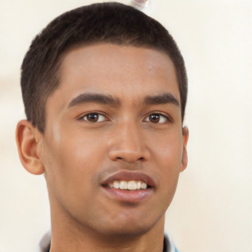 Joyful latino young-adult male with short  brown hair and brown eyes