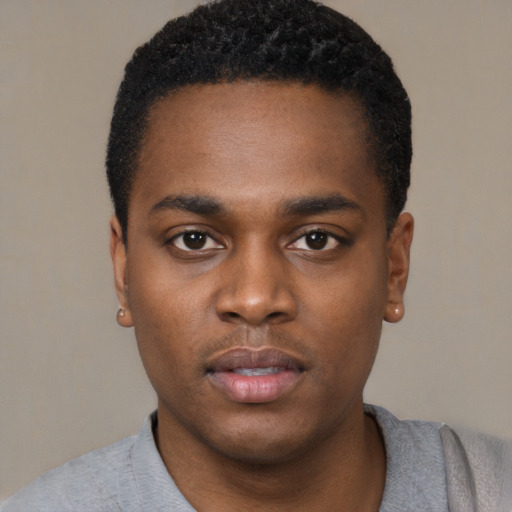 Neutral black young-adult male with short  black hair and brown eyes