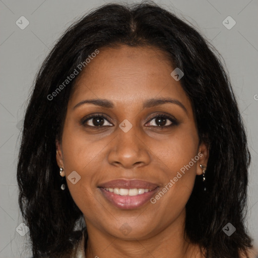 Joyful black young-adult female with long  brown hair and brown eyes