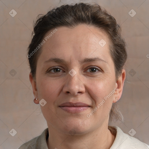 Joyful white adult female with short  brown hair and brown eyes