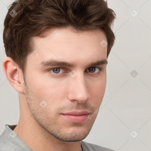 Neutral white young-adult male with short  brown hair and grey eyes