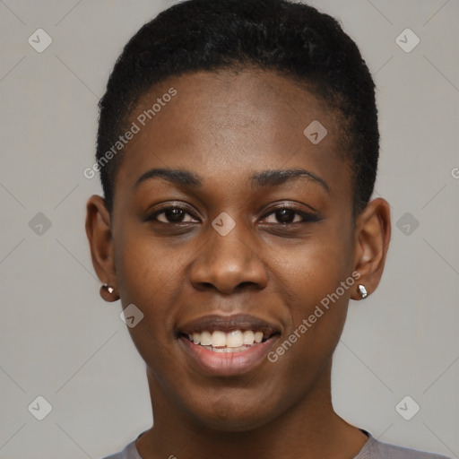 Joyful black young-adult female with short  black hair and brown eyes