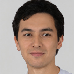 Joyful asian young-adult male with short  black hair and brown eyes