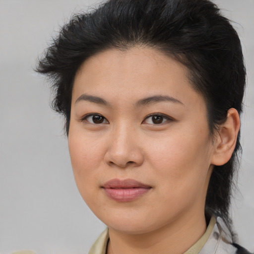 Joyful asian young-adult female with medium  brown hair and brown eyes