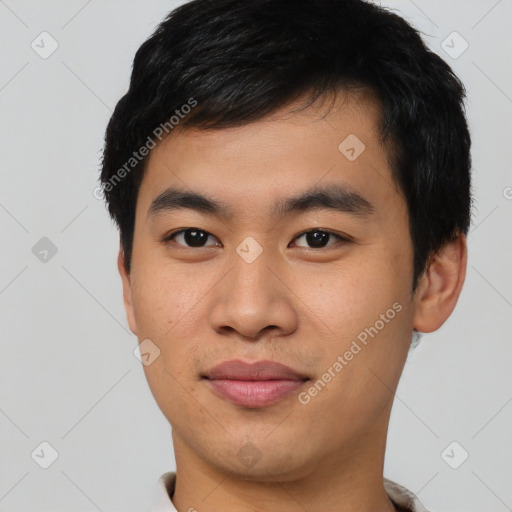 Joyful asian young-adult male with short  black hair and brown eyes