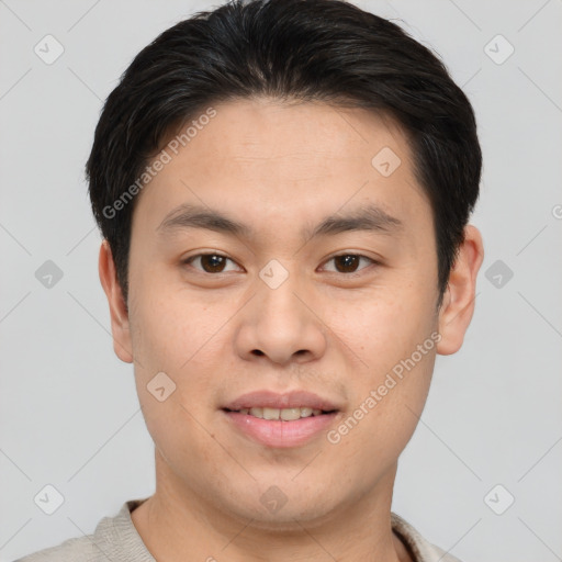 Joyful asian young-adult male with short  brown hair and brown eyes