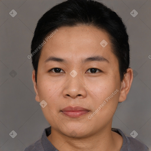 Joyful asian young-adult male with short  black hair and brown eyes