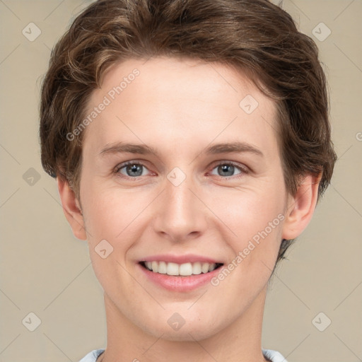 Joyful white young-adult female with short  brown hair and grey eyes