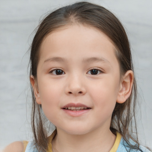 Joyful white child female with medium  brown hair and brown eyes