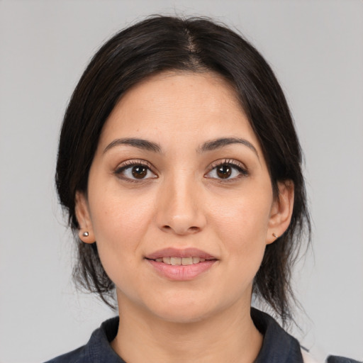 Joyful asian young-adult female with medium  black hair and brown eyes
