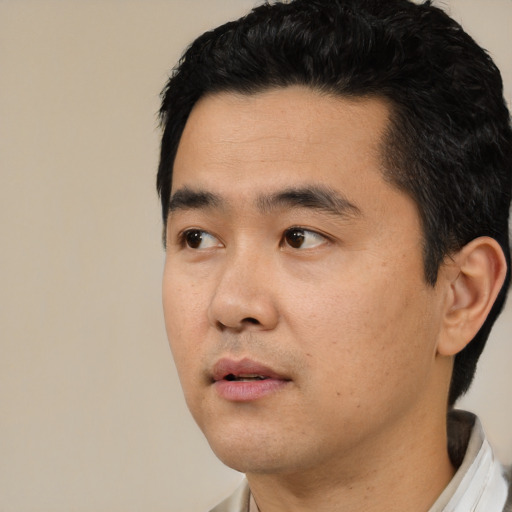 Neutral asian young-adult male with short  black hair and brown eyes