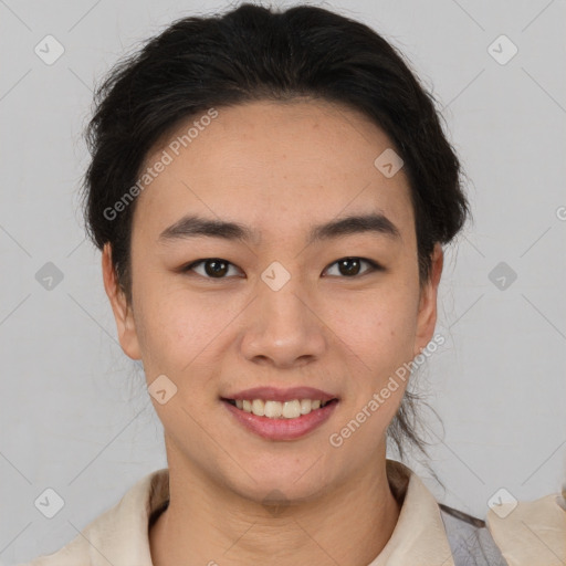 Joyful asian young-adult female with short  brown hair and brown eyes