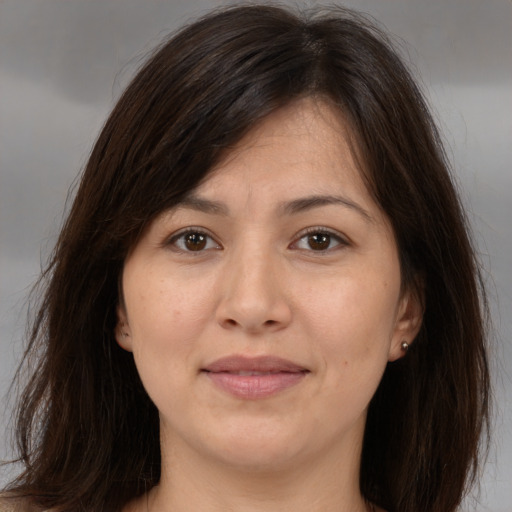 Joyful white adult female with medium  brown hair and brown eyes