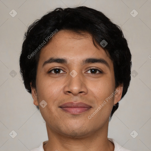 Joyful latino young-adult male with short  brown hair and brown eyes