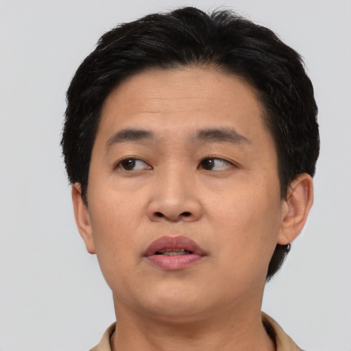 Neutral asian young-adult male with short  black hair and brown eyes