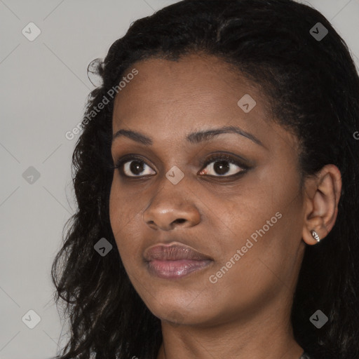 Joyful black young-adult female with long  brown hair and brown eyes