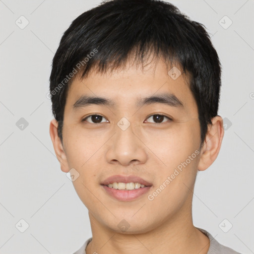 Joyful asian young-adult male with short  black hair and brown eyes