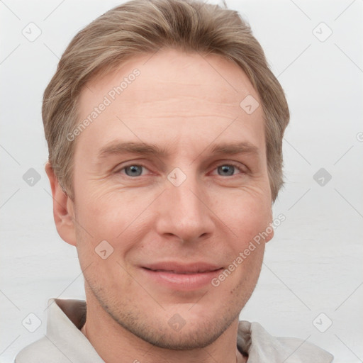 Joyful white adult male with short  brown hair and grey eyes