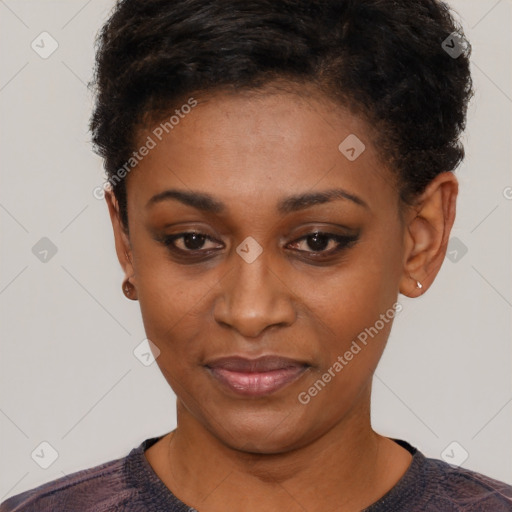 Joyful black young-adult female with short  black hair and brown eyes