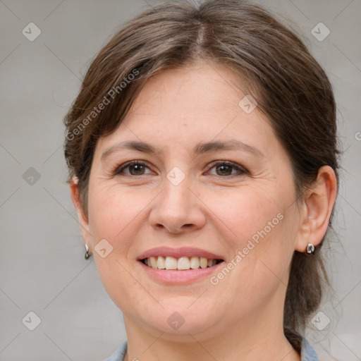 Joyful white adult female with medium  brown hair and grey eyes