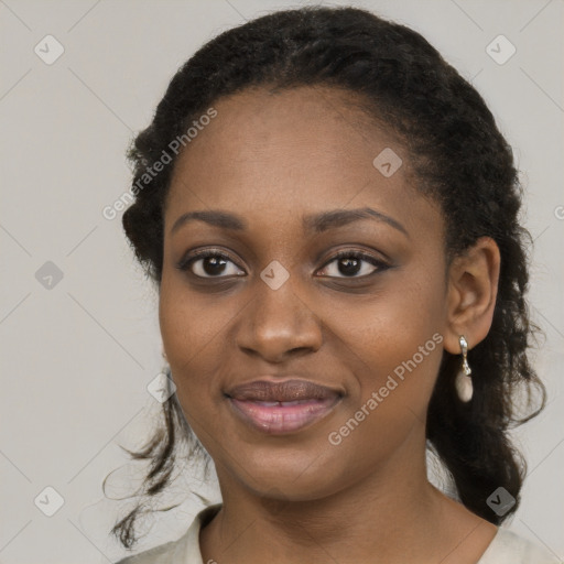 Joyful black young-adult female with medium  black hair and brown eyes