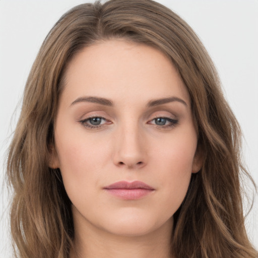 Neutral white young-adult female with long  brown hair and brown eyes