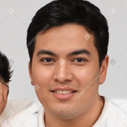 Joyful asian young-adult male with short  brown hair and brown eyes