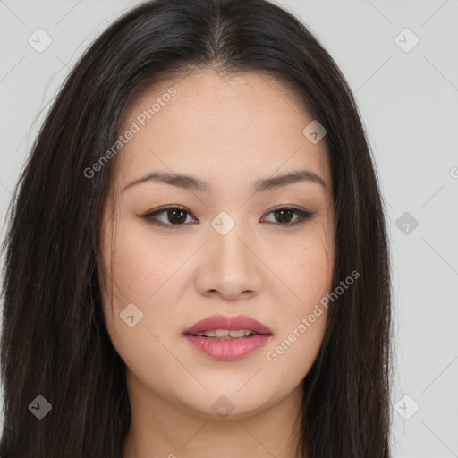 Joyful asian young-adult female with long  brown hair and brown eyes