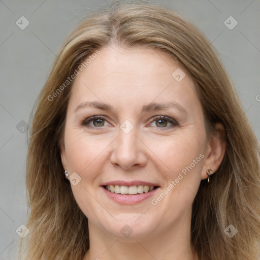 Joyful white adult female with medium  brown hair and grey eyes