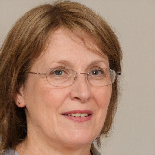 Joyful white middle-aged female with medium  brown hair and blue eyes