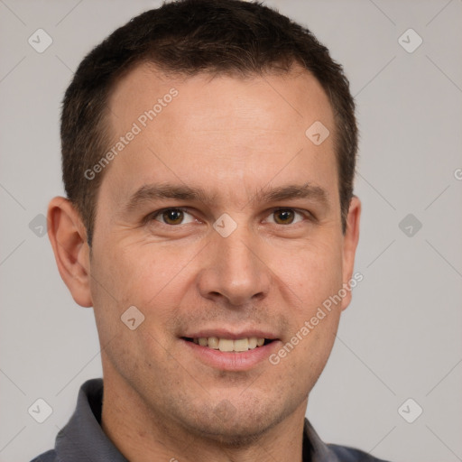 Joyful white adult male with short  brown hair and brown eyes