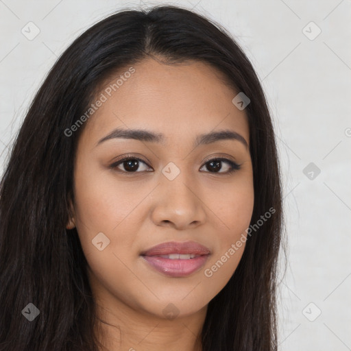 Joyful latino young-adult female with long  brown hair and brown eyes