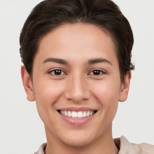 Joyful white young-adult female with short  brown hair and brown eyes