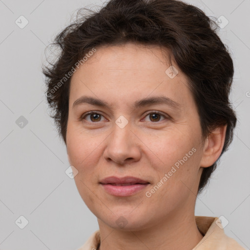 Joyful white adult female with short  brown hair and brown eyes