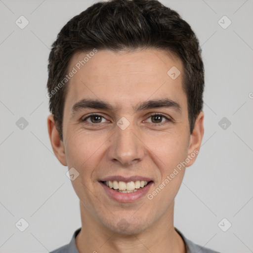 Joyful white young-adult male with short  black hair and brown eyes