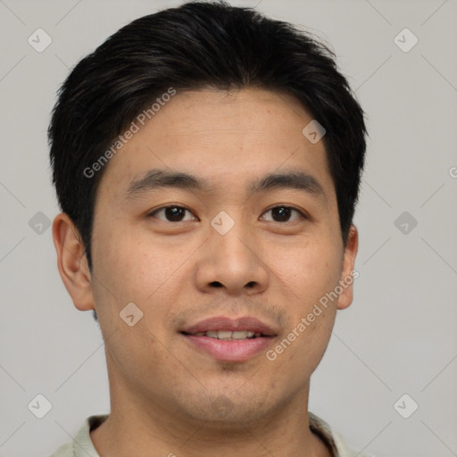 Joyful asian young-adult male with short  brown hair and brown eyes