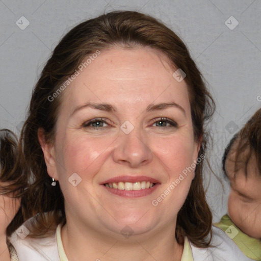 Joyful white adult female with medium  brown hair and blue eyes