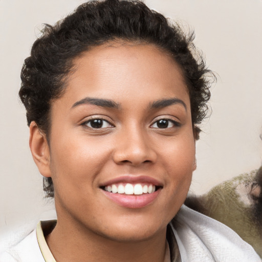 Joyful white young-adult female with short  brown hair and brown eyes