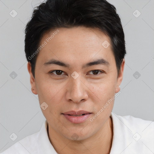Joyful asian young-adult male with short  black hair and brown eyes