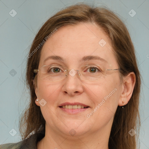 Joyful white adult female with medium  brown hair and blue eyes