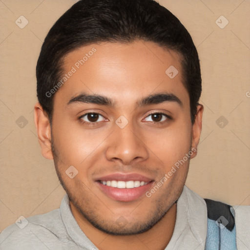 Joyful latino young-adult male with short  brown hair and brown eyes